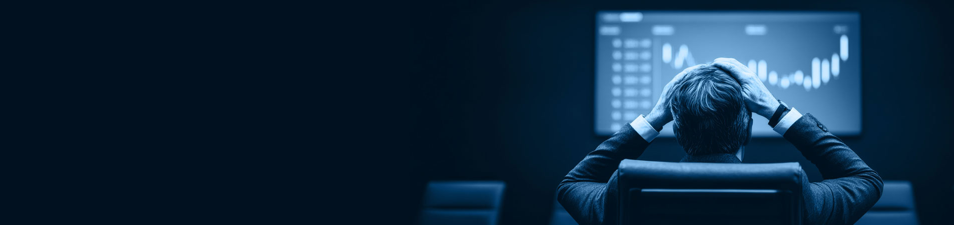 businessman in stressful situation analyzing financial data on large screen in dark conference room